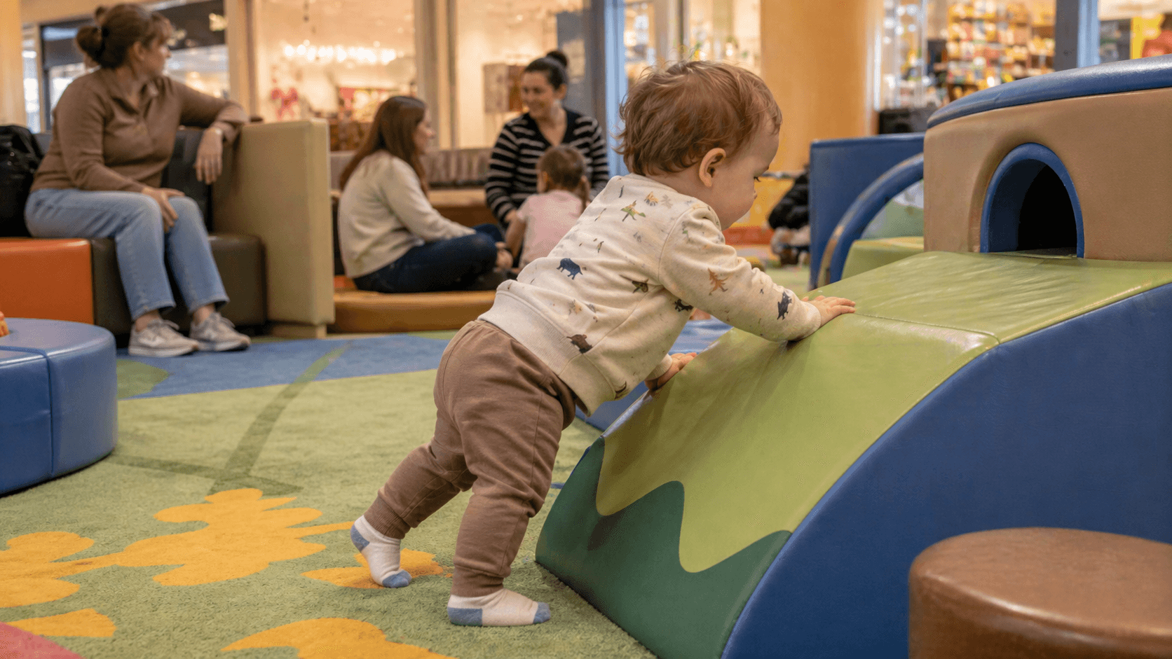 Toddler playing at a free indoor mall play area in the United States