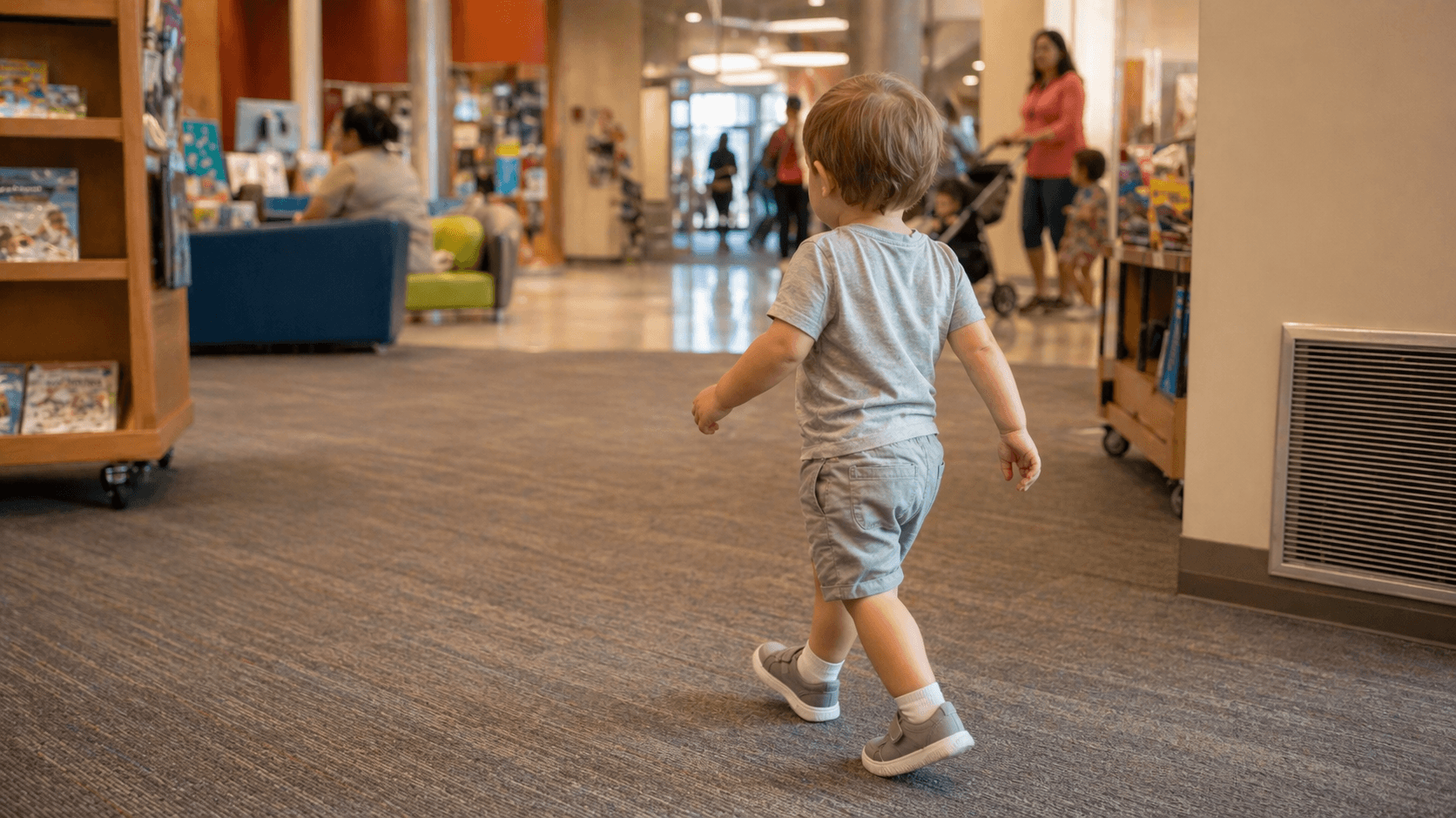 Toddler walking through a cool indoor public space on a hot summer day in the US