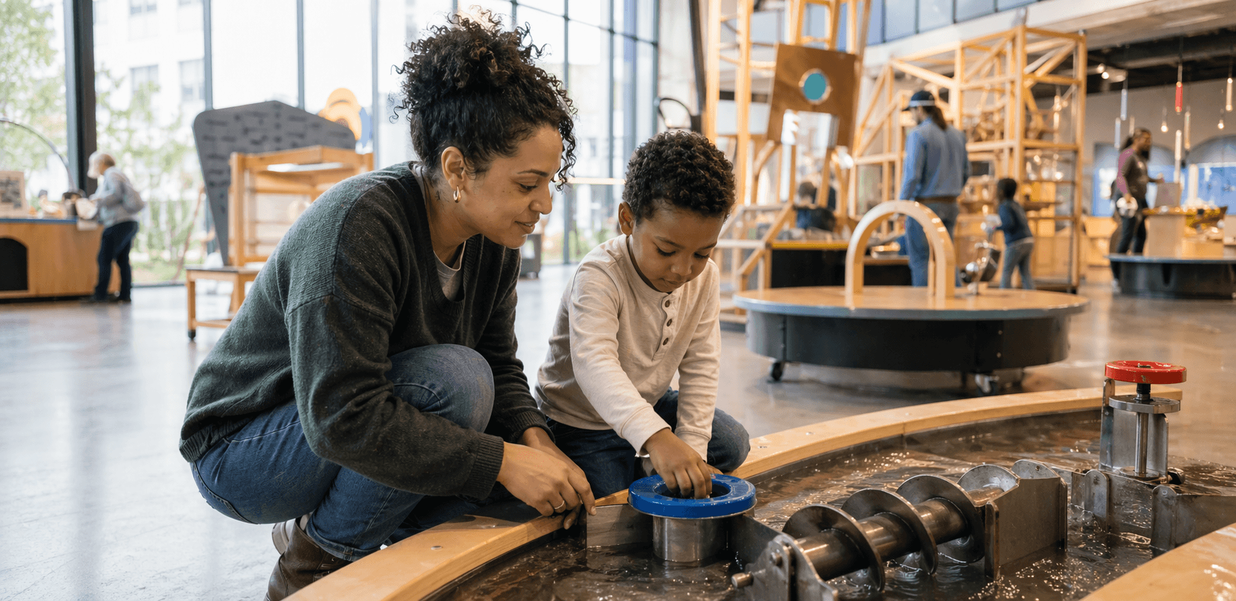 Child exploring hands-on science exhibits at a children's museum
