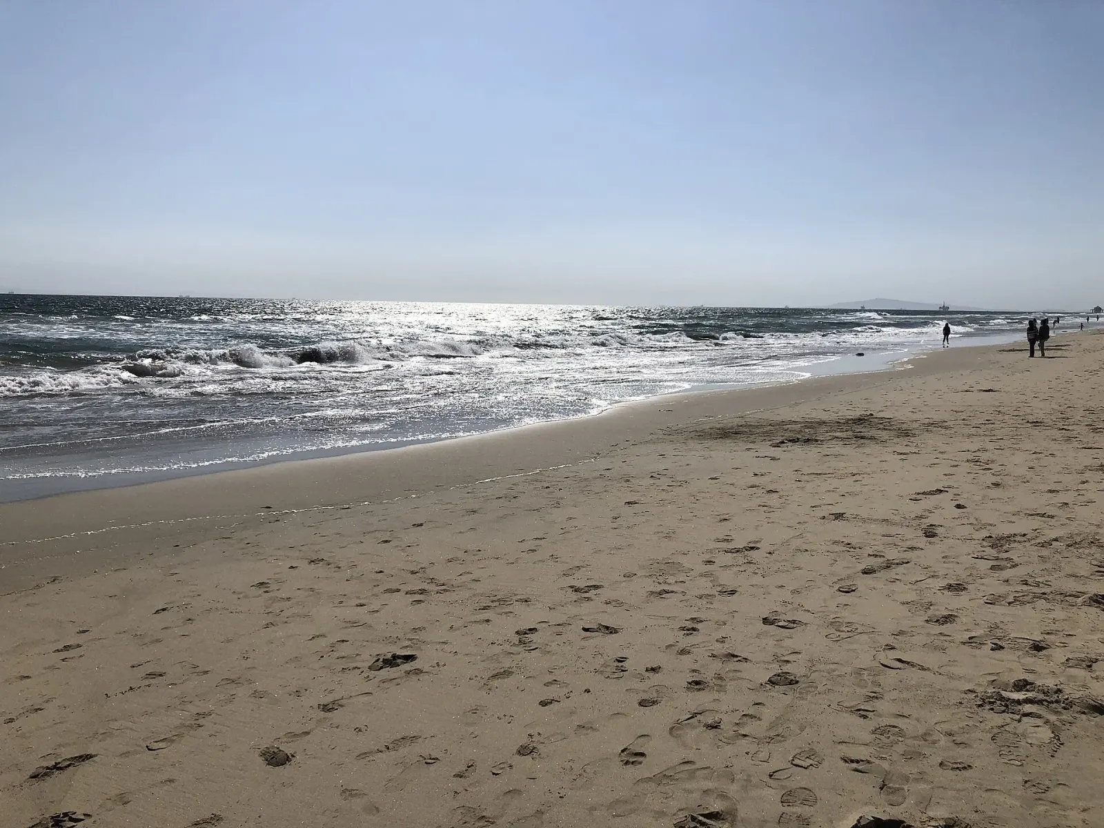 Wide sandy shoreline at Huntington State Beach